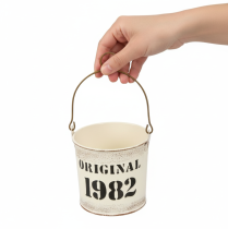 Artikel Dekorativ spand med hank “Original 1982” Cremefarvet Ø12/10cm 2×2-delt sæt
