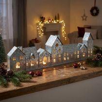 Artikel Dekorativ række af huse med fyrfadsstager, adventsdekoration, 68 cm