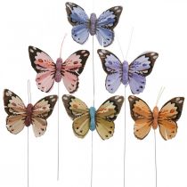 Fjersommerfugle, dekorative sommerfugle på pind, blomsterpropper pink, orange, violet, brun, blå, beige 6×8cm 12 stk.