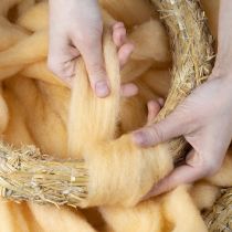 Artikel Uldsnor, uldbånd, cremeorange, 10m uld til kranse og arrangementer