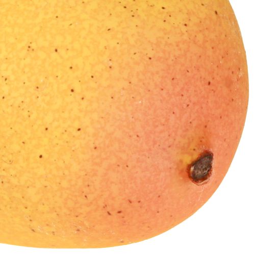 Artikel Kunstig mango som en eksotisk dekorativ frugt til hjemmet