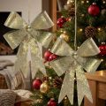 Sløjfer af metal, julevedhæng, adventsdekoration gyldent, antikt look H18cm B12,5cm 2stk | Floristik24.dk