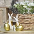 Floristik24 Påskehare hvid-gylden, påskedekoration, dekorativ kanin med æg H16/18cm sæt med 2 stk.